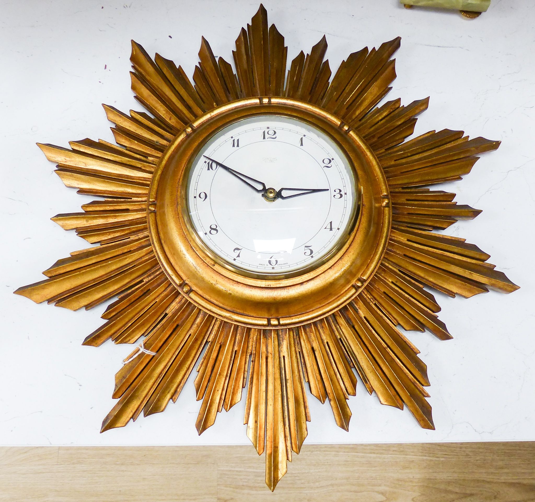 A gilt painted sunburst wall clock 50cm